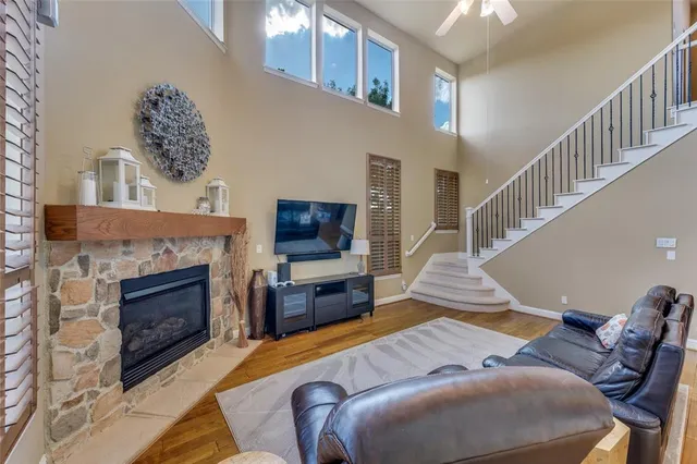 a living room with furniture fireplace and flat screen tv