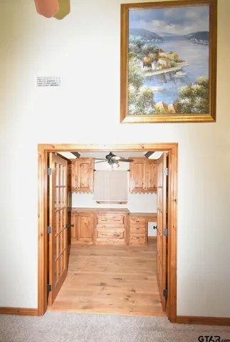 a view of a room with wooden floor