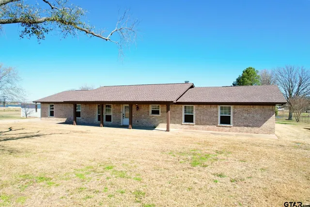 a house with trees in the background