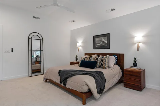 a bathroom with a shower sink and mirror