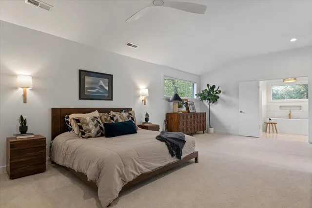a bathroom with a sink a mirror and vanity
