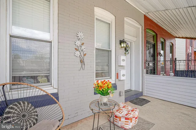 a balcony with furniture and potted plant