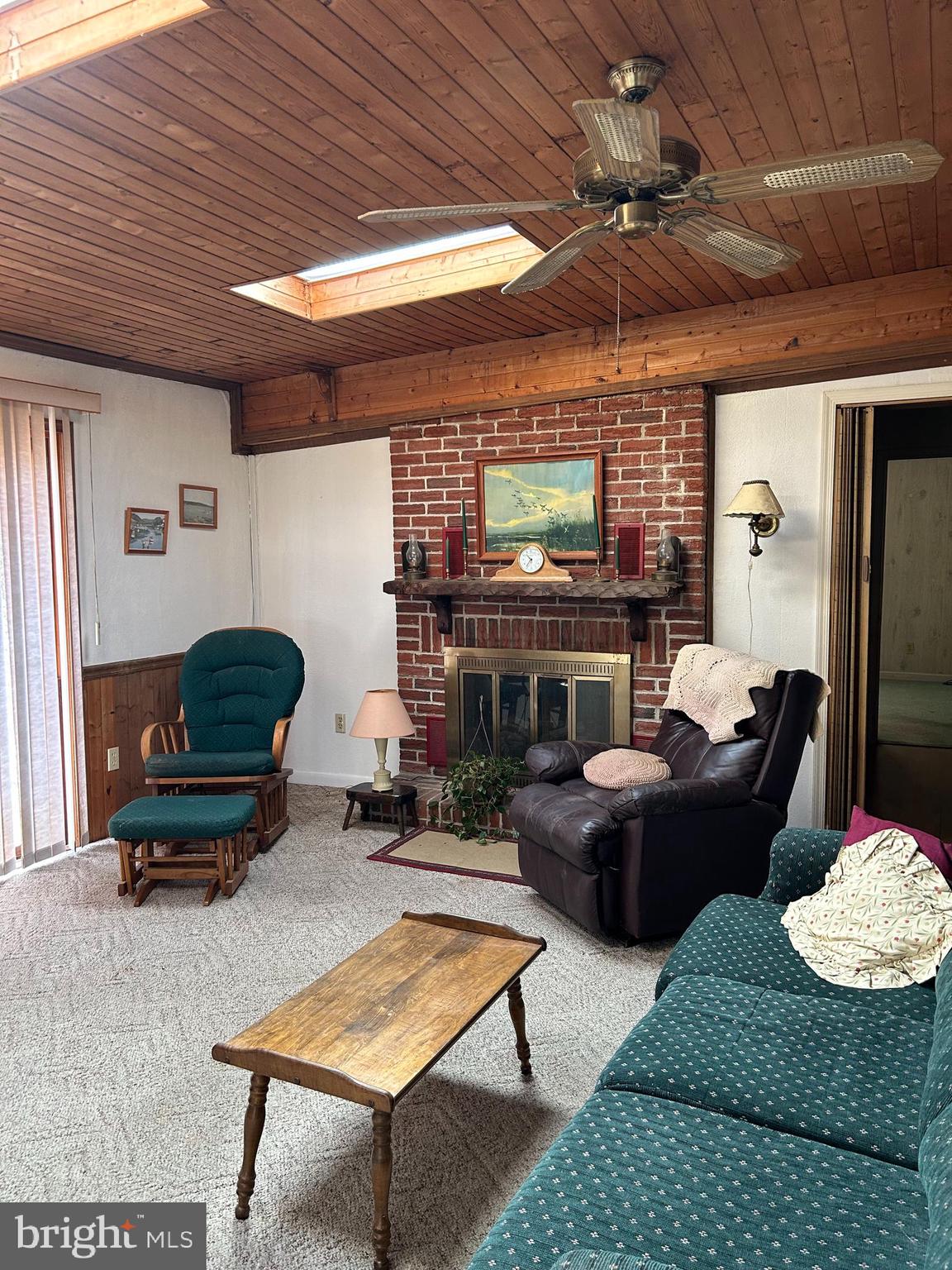 124 Karl Drive Dover, DE 19901 - Photo 21 of 58 a living room with furniture a fireplace and a flat screen tv