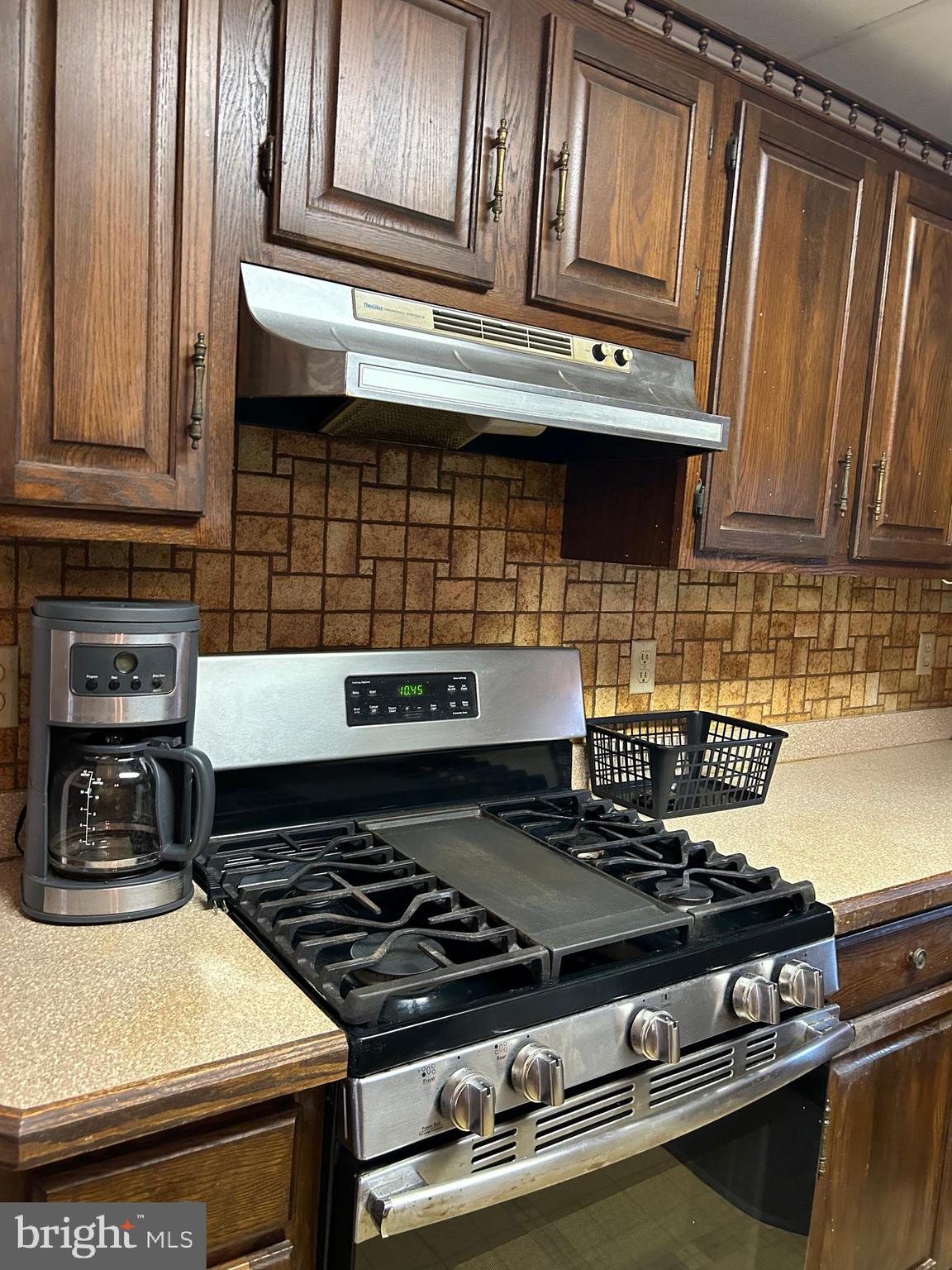 124 Karl Drive Dover, DE 19901 - Photo 35 of 58 a stove top oven sitting inside of a kitchen