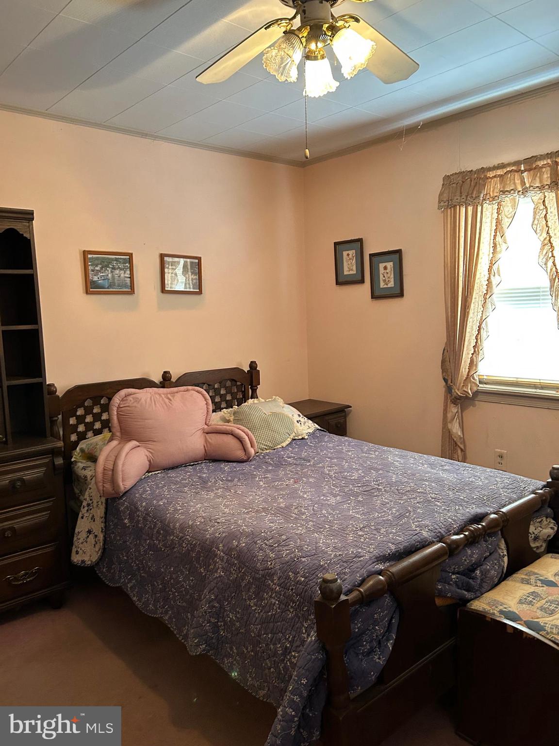 124 Karl Drive Dover, DE 19901 - Photo 42 of 58 a bed sitting in a bedroom next to a window