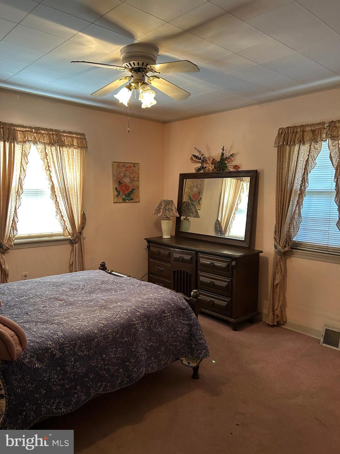 124 Karl Drive Dover, DE 19901 - Photo 43 of 58 a bedroom with a bed and a chandelier