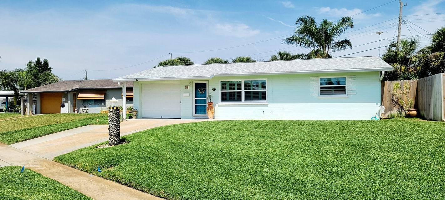 a house view with a garden space