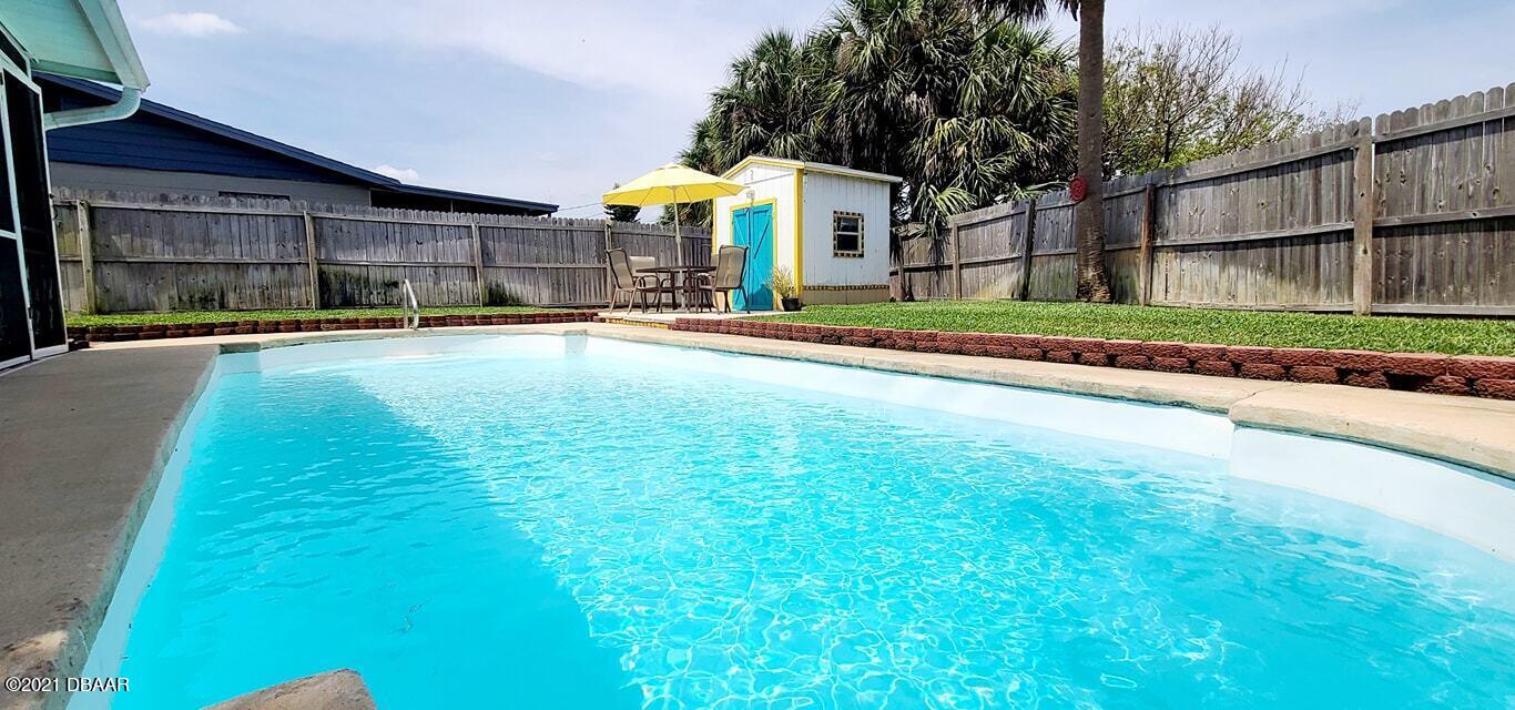 53 Seacrest Drive Ormond Beach, FL 32176 - Photo 23 of 34 a view of a house with a yard and sitting area