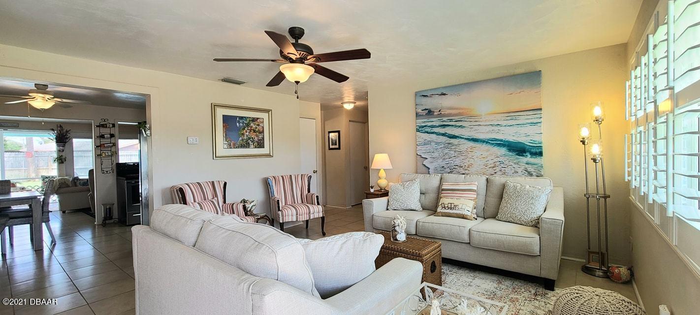 53 Seacrest Drive Ormond Beach, FL 32176 - Photo 3 of 34 a living room with furniture and a large window