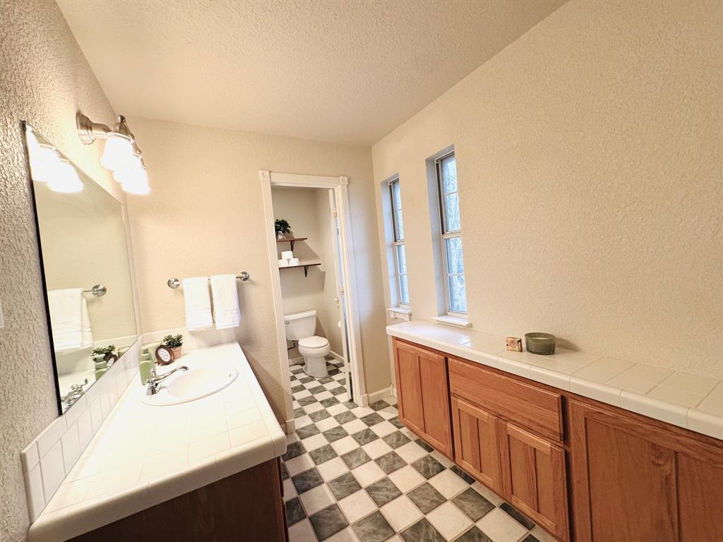 400 Indian Hills Road Gatesville, TX 76528 - Photo 21 of 38 a bathroom with a sink and a mirror