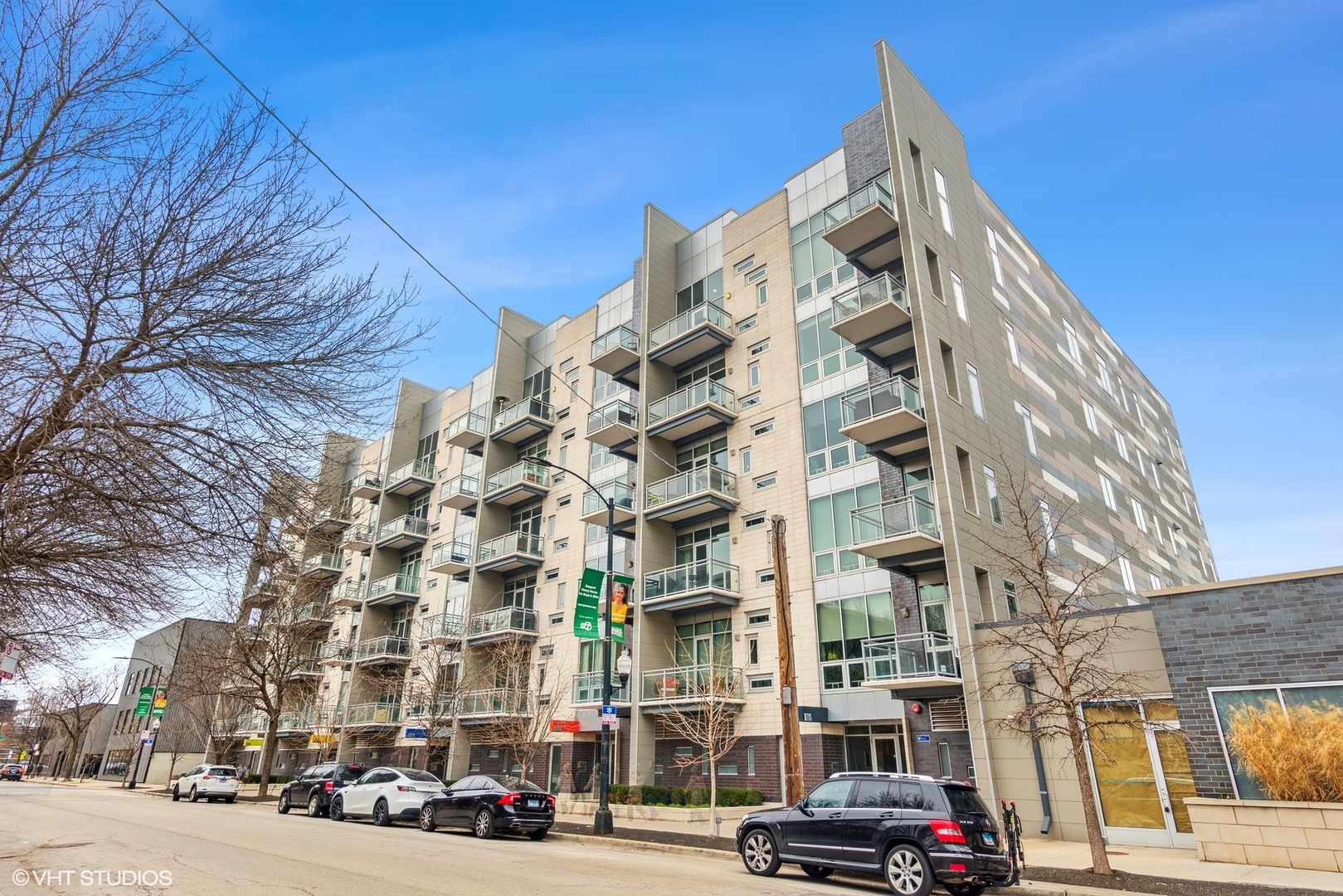a city street lined with buildings and cars