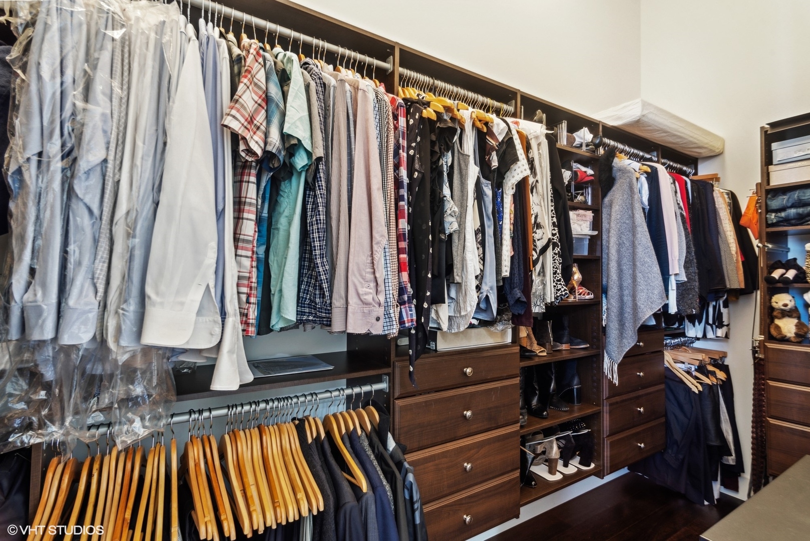 1116 West Adams Street, Unit PHW Chicago, IL 60607 - Photo 11 of 18 a view of walk in closet with clothes and shoes