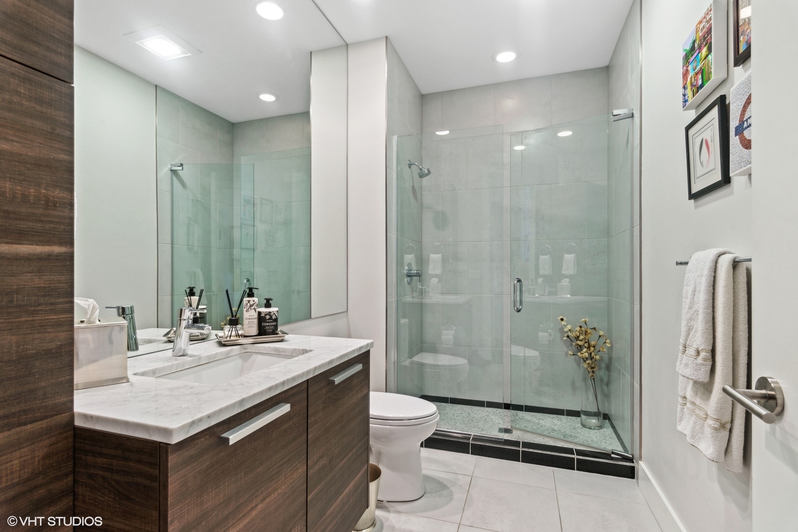 1116 West Adams Street, Unit PHW Chicago, IL 60607 - Photo 14 of 18 a bathroom with a sink a toilet and shower