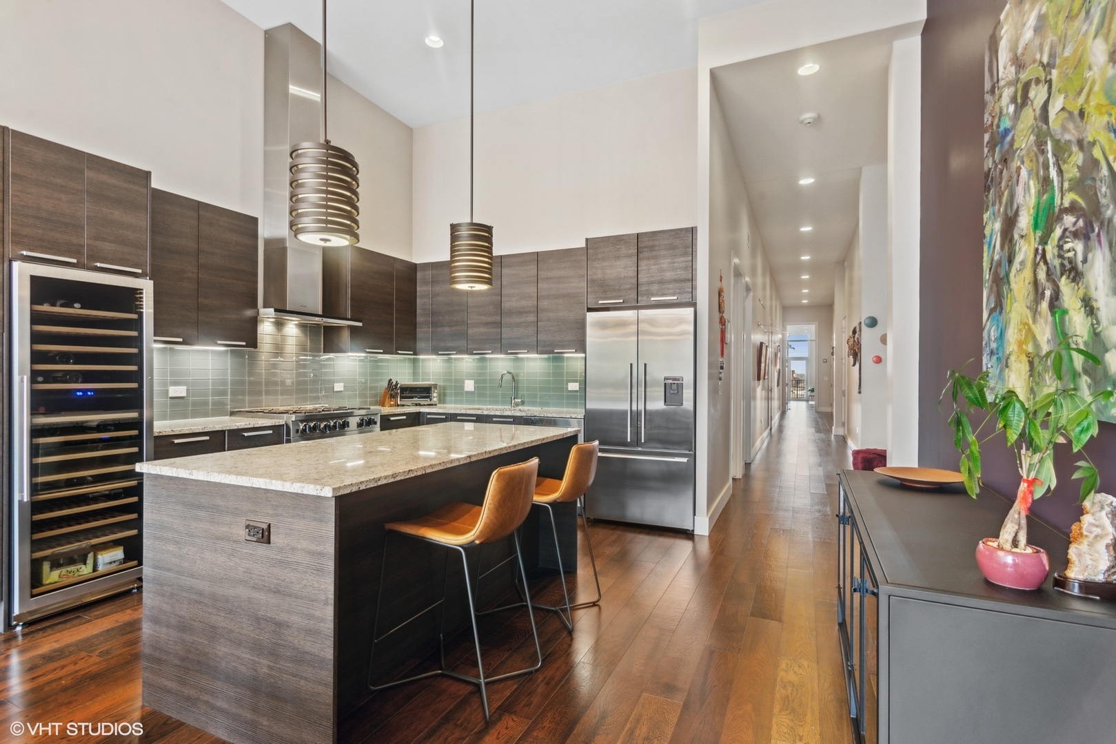 1116 West Adams Street, Unit PHW Chicago, IL 60607 - Photo 6 of 18 a kitchen with stainless steel appliances granite countertop a stove and cabinets