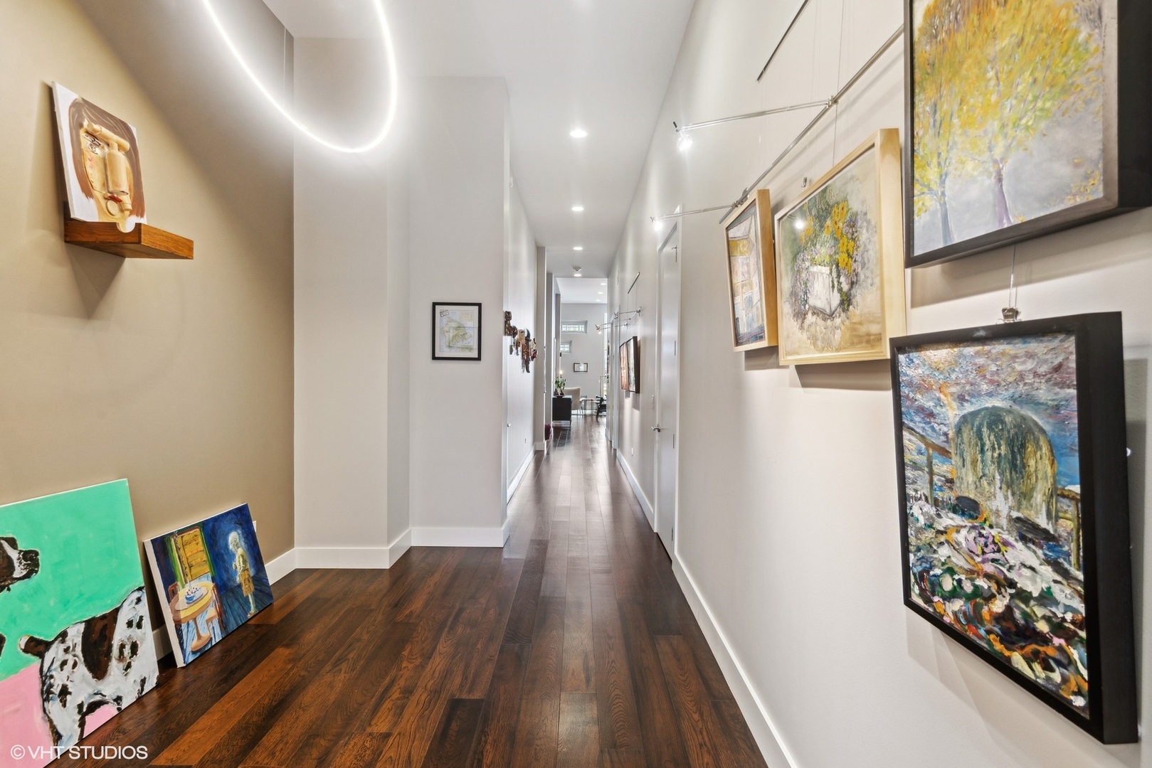 1116 West Adams Street, Unit PHW Chicago, IL 60607 - Photo 8 of 18 a view of a hallway with wooden floor and staircase