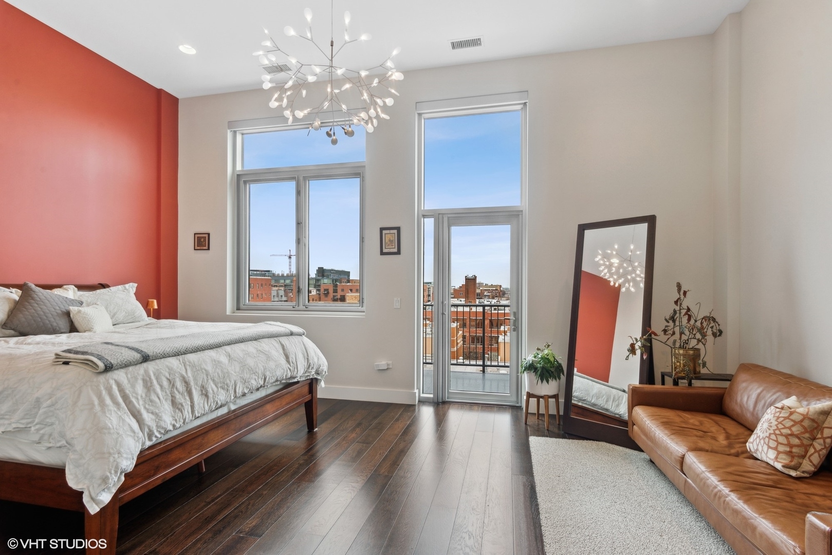 1116 West Adams Street, Unit PHW Chicago, IL 60607 - Photo 9 of 18 a living room with furniture and a chandelier