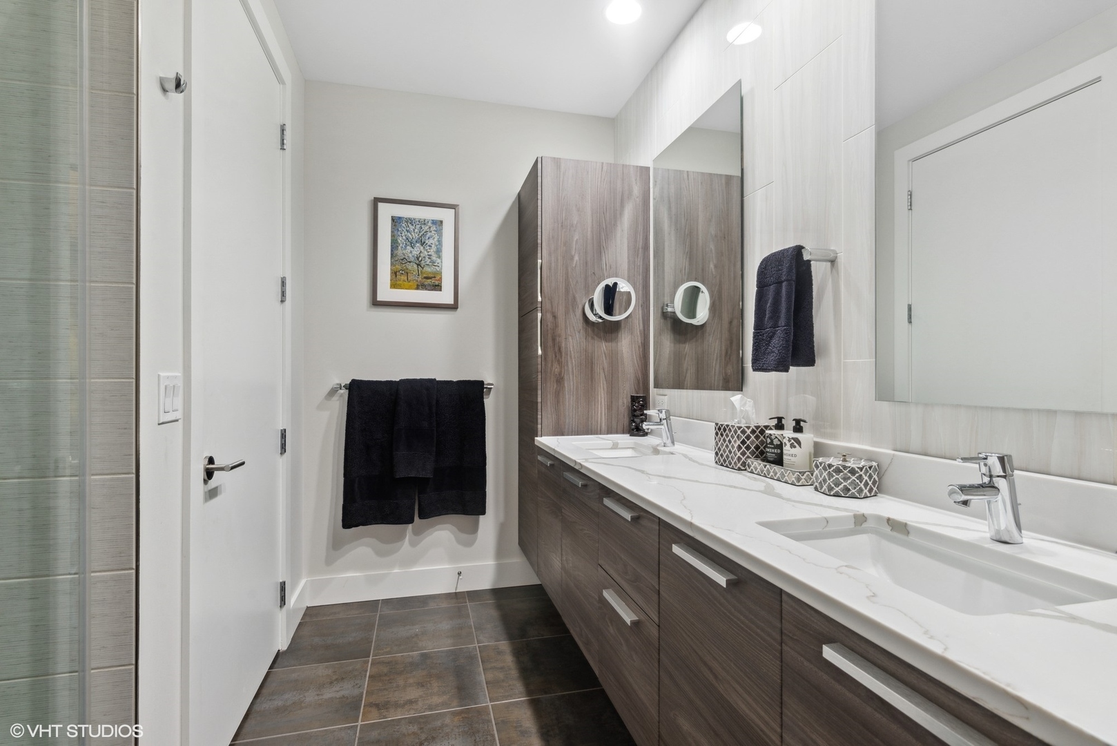 1116 West Adams Street, Unit PHW Chicago, IL 60607 - Photo 10 of 18 a bathroom with a double vanity sink a mirror and a shower