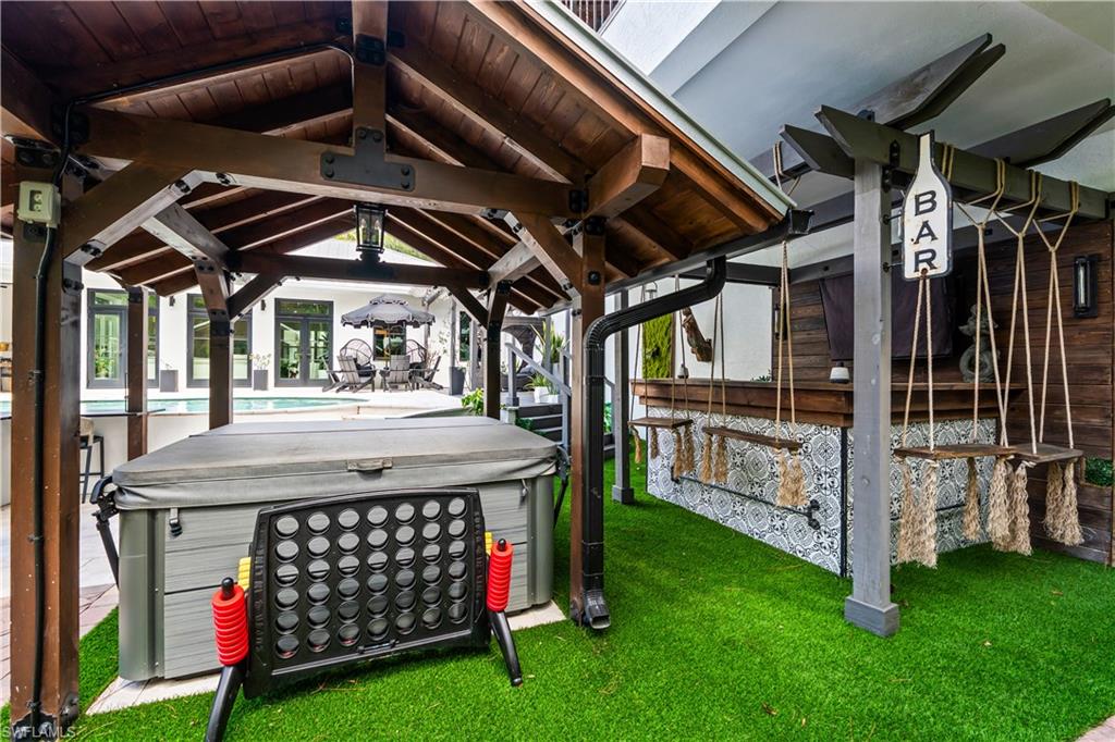 6370 Hunters Road Naples, FL 34109 - Photo 42 of 50 Hot Tub and Swing Bar