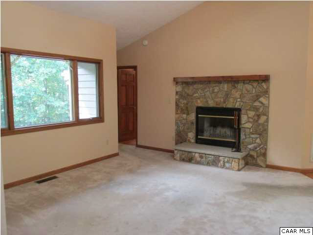 14 Amethyst Road Palmyra, VA 22963 - Photo 4 of 24 an empty room with a fireplace and window