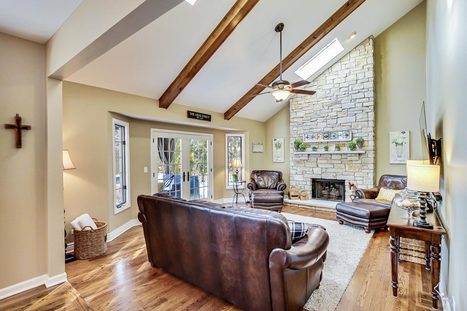 2616 High Meadow Road Naperville, IL 60564 - Photo 11 of 47 a living room with furniture and a fireplace