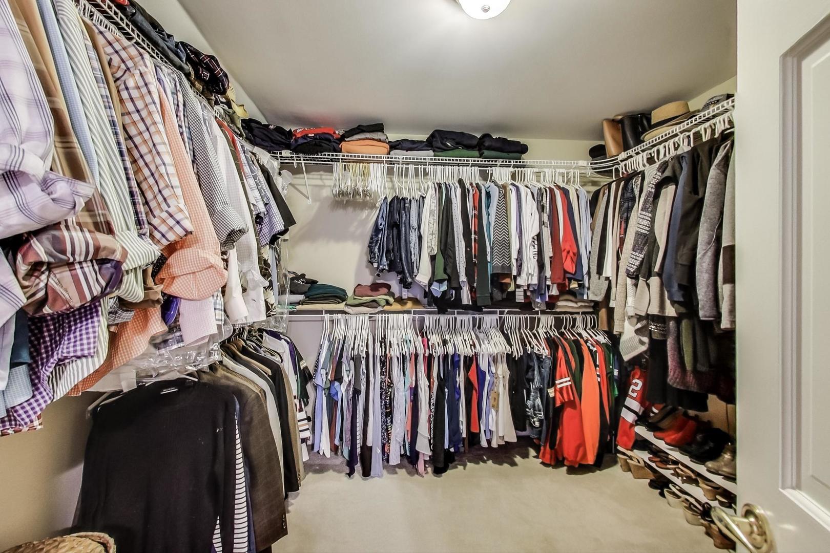 2616 High Meadow Road Naperville, IL 60564 - Photo 25 of 47 a view of walk in closet with clothes