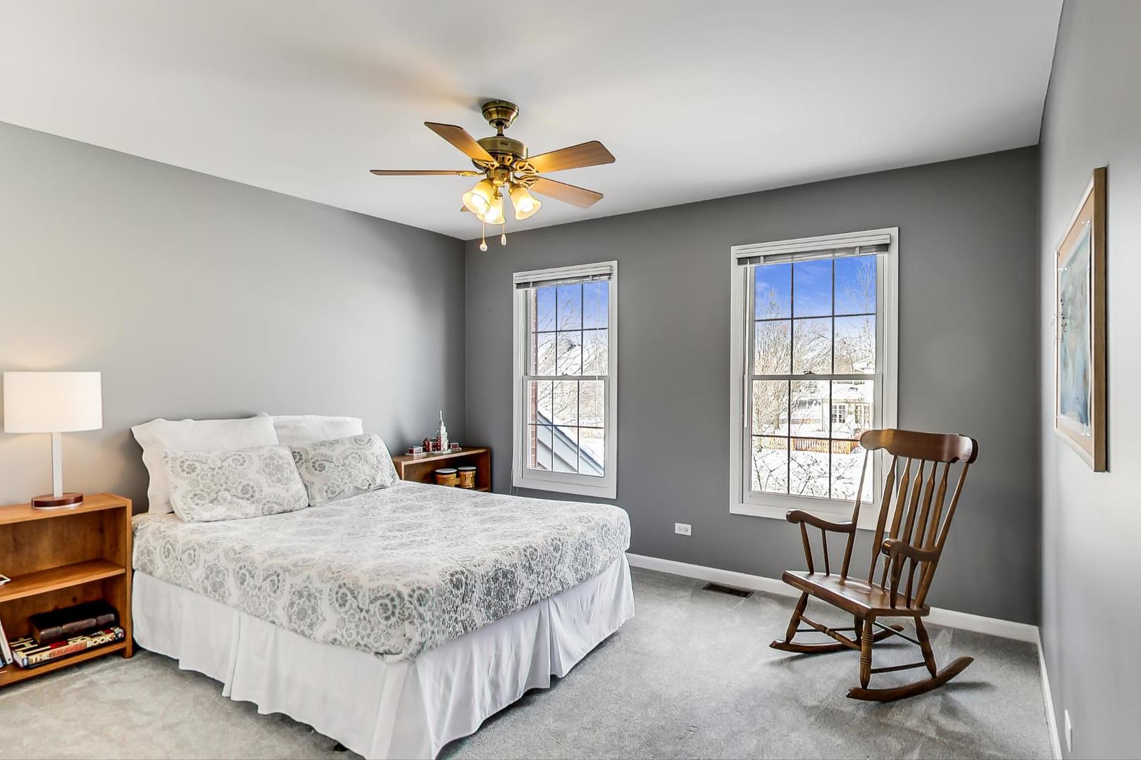 2616 High Meadow Road Naperville, IL 60564 - Photo 27 of 47 a bedroom with a bed a chair and a window