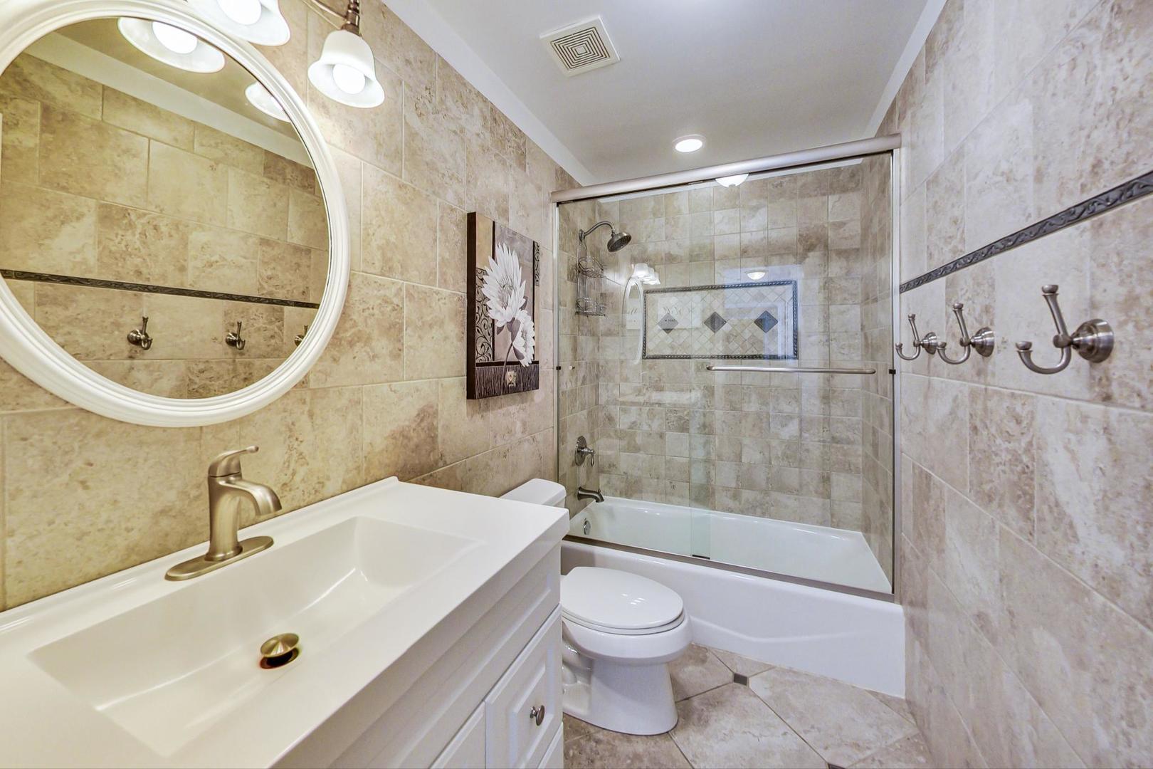 2616 High Meadow Road Naperville, IL 60564 - Photo 29 of 47 a bathroom with a sink a toilet and shower