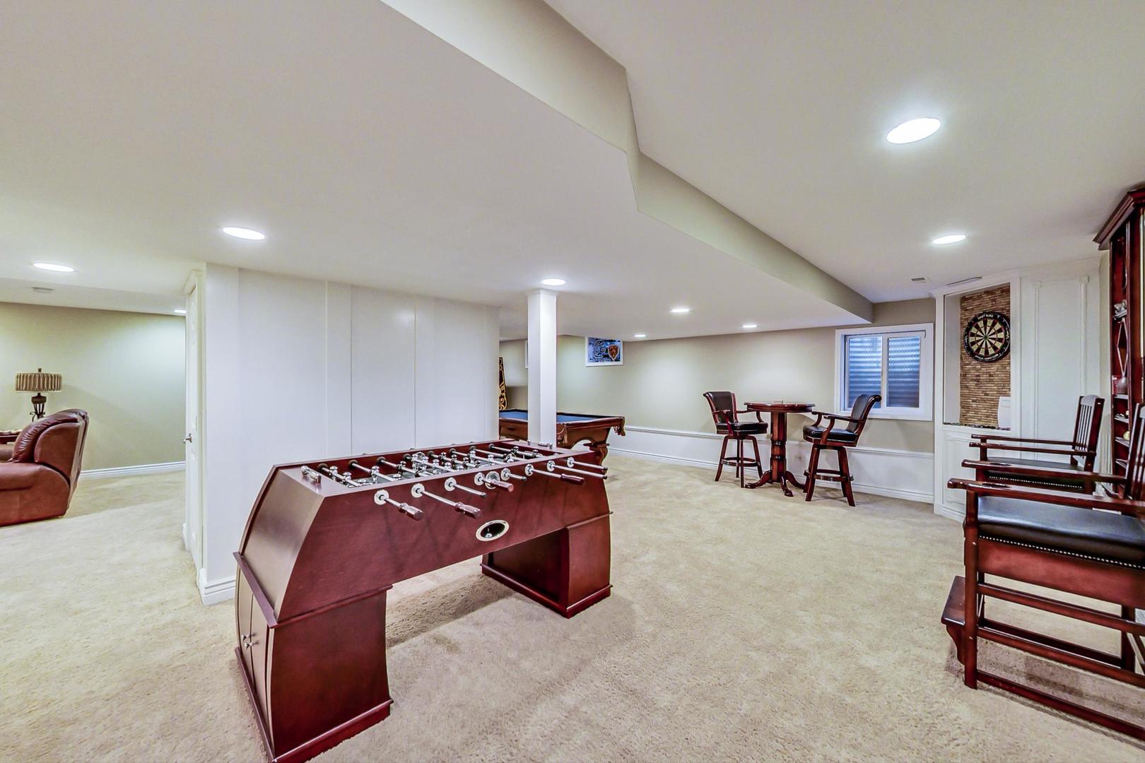 2616 High Meadow Road Naperville, IL 60564 - Photo 38 of 47 a bed room with furniture and a flat screen tv
