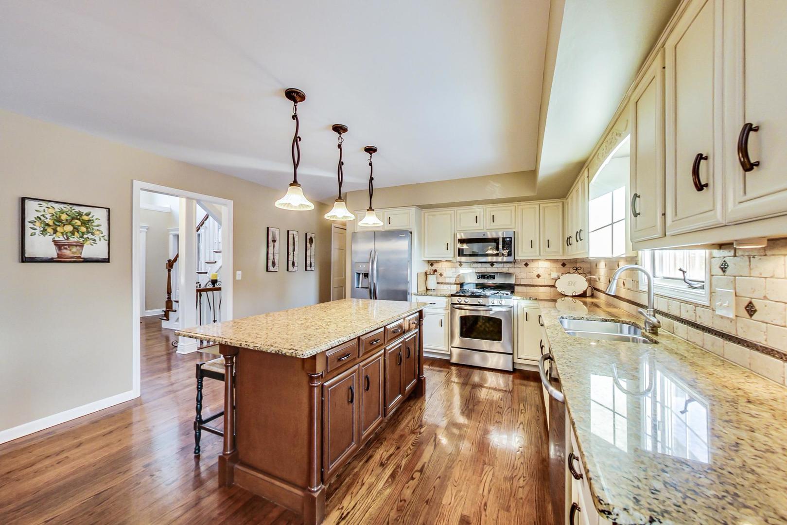 2616 High Meadow Road Naperville, IL 60564 - Photo 6 of 47 a kitchen with stainless steel appliances granite countertop a stove oven and a refrigerator