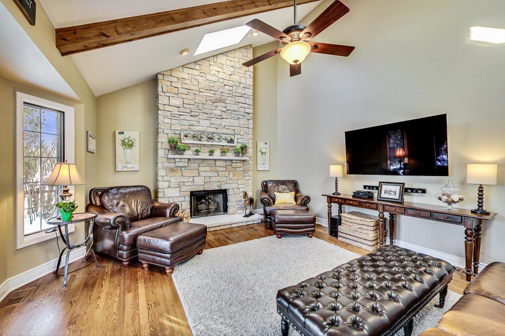 2616 High Meadow Road Naperville, IL 60564 - Photo 9 of 47 a living room with furniture and a flat screen tv