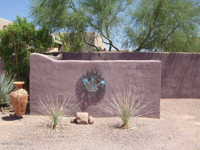 377 South Prospectors Road Apache Junction, AZ 85119 - Photo 14 of 43 STUCCO WALL IN FRONT OF POOL EQUIPMENT