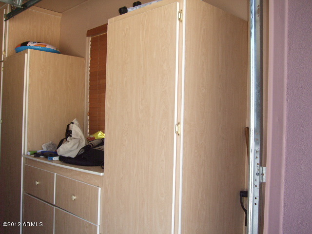 377 South Prospectors Road Apache Junction, AZ 85119 - Photo 9 of 43 CABINETS IN GARAGE