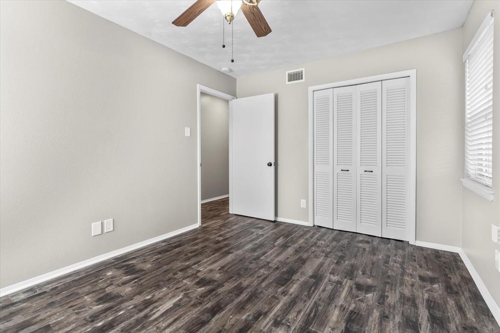 1251 Donna Drive Richardson, TX 75080 - Photo 16 of 39 wooden floor in an empty room with a window