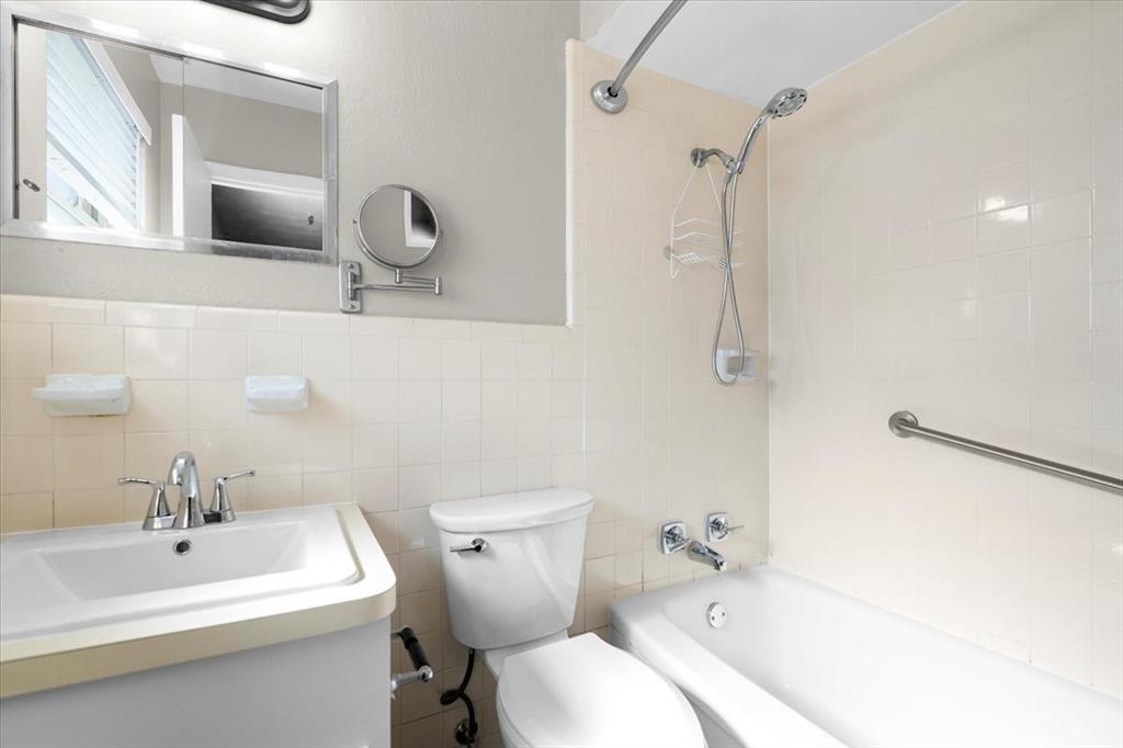 1251 Donna Drive Richardson, TX 75080 - Photo 18 of 39 a bathroom with a sink a toilet and shower