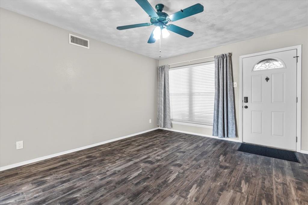 1251 Donna Drive Richardson, TX 75080 - Photo 2 of 39 wooden floor in an empty room with a window