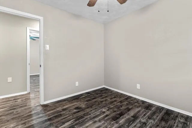 a view of a room with wooden floor and closet