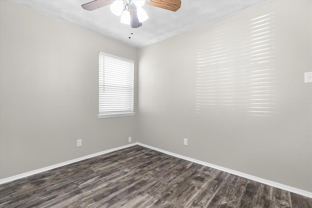 1251 Donna Drive Richardson, TX 75080 - Photo 26 of 39 wooden floor in an empty room with a window