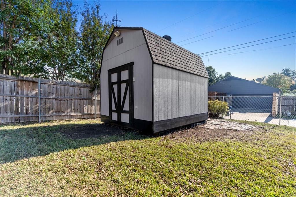 1251 Donna Drive Richardson, TX 75080 - Photo 29 of 39 a view of a house with a yard
