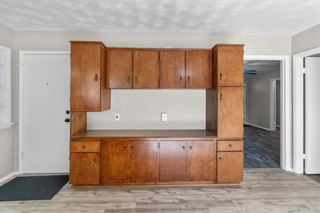 a view of workspace with wooden cabinet