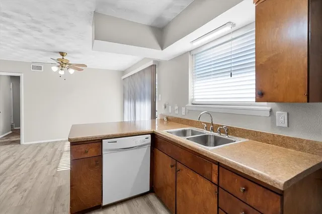 a kitchen with a sink and cabinets