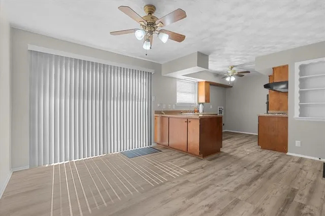 a view of a kitchen with a sink and a window
