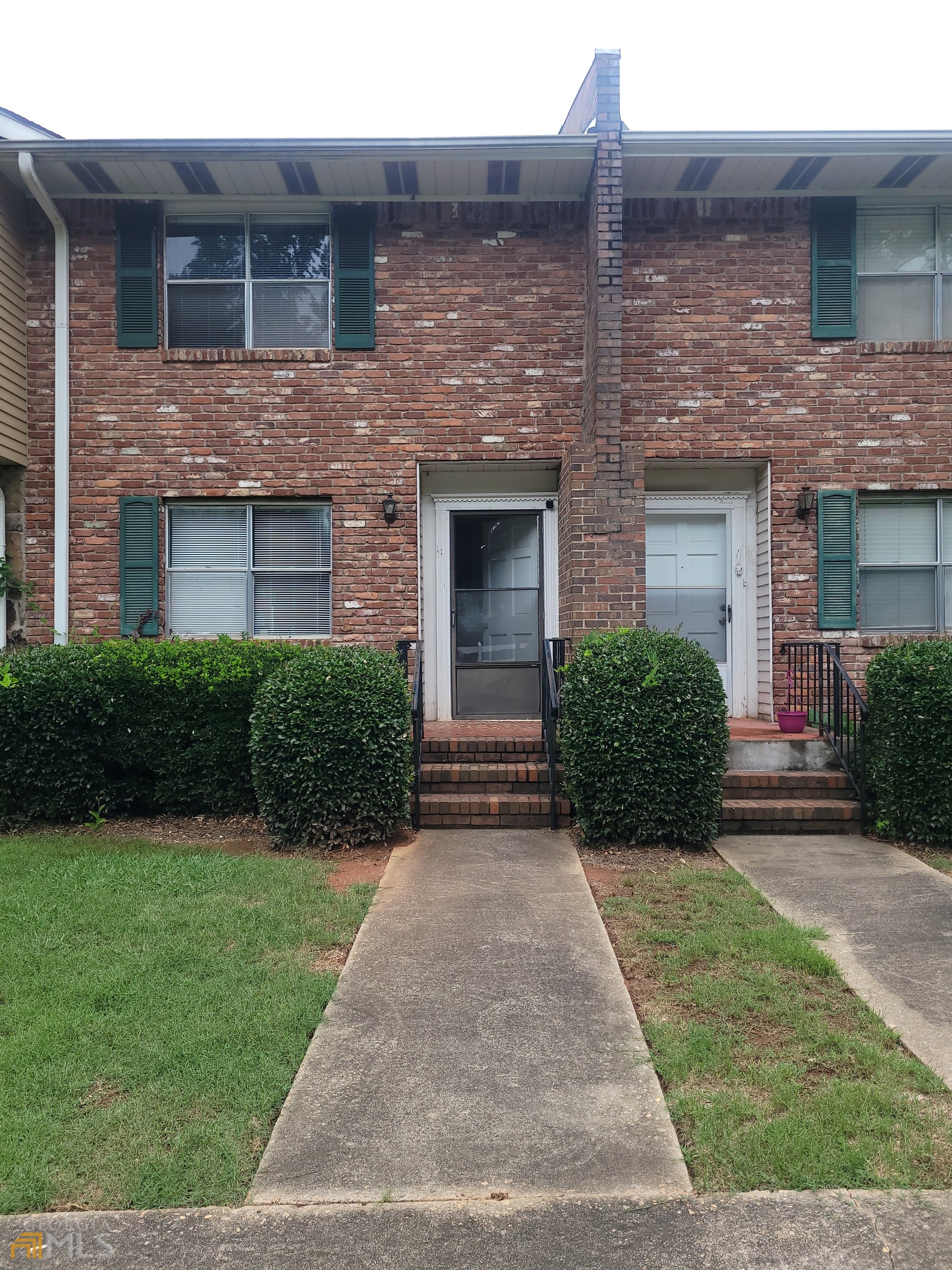 501 Carlton Road, Unit 2D Palmetto, GA 30268 - Photo 1 of 1 a front view of a house with garden