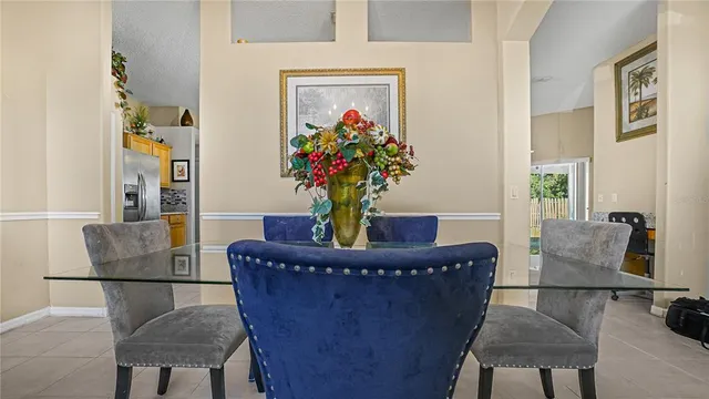 a living room with furniture a couch and a potted plant