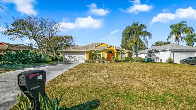 a front view of house with yard and seating area