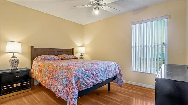a bedroom with a bed and window