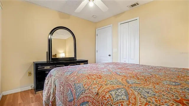 a bedroom with a bed and a dresser