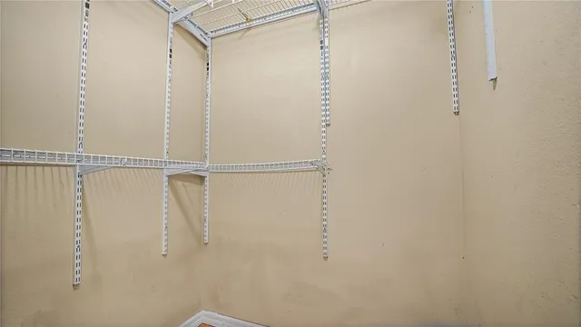 a view of bathroom with bathtub and view living room