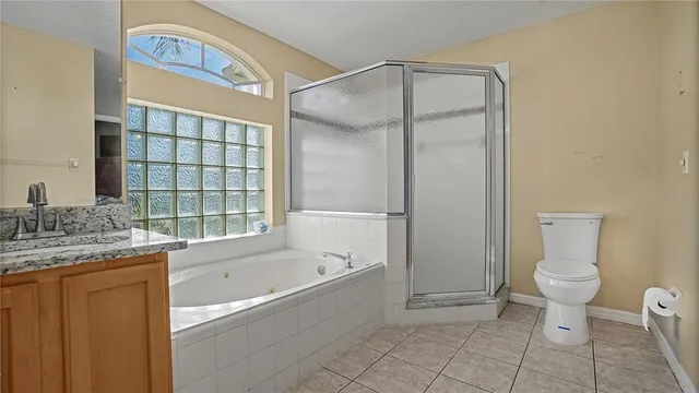 a bath tub sitting in a bathroom next to a window