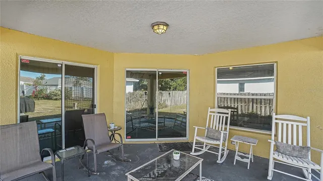 an aerial view of residential house with outdoor space and swimming pool
