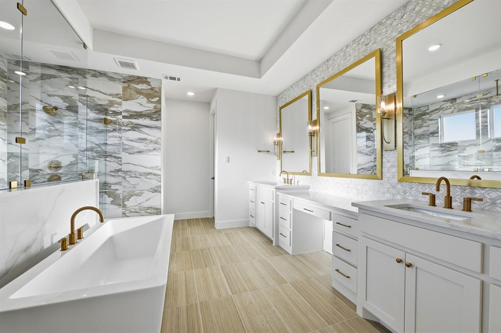 3700 Meander Way Prosper, TX 75078 - Photo 12 of 29 a bathroom with a double vanity sink a mirror and a shower